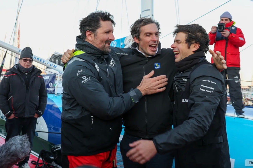 Charlie Dalin, Yoann Richomme and Sébastien Simon celebrate as the top three finishers in the Vendée Globe.